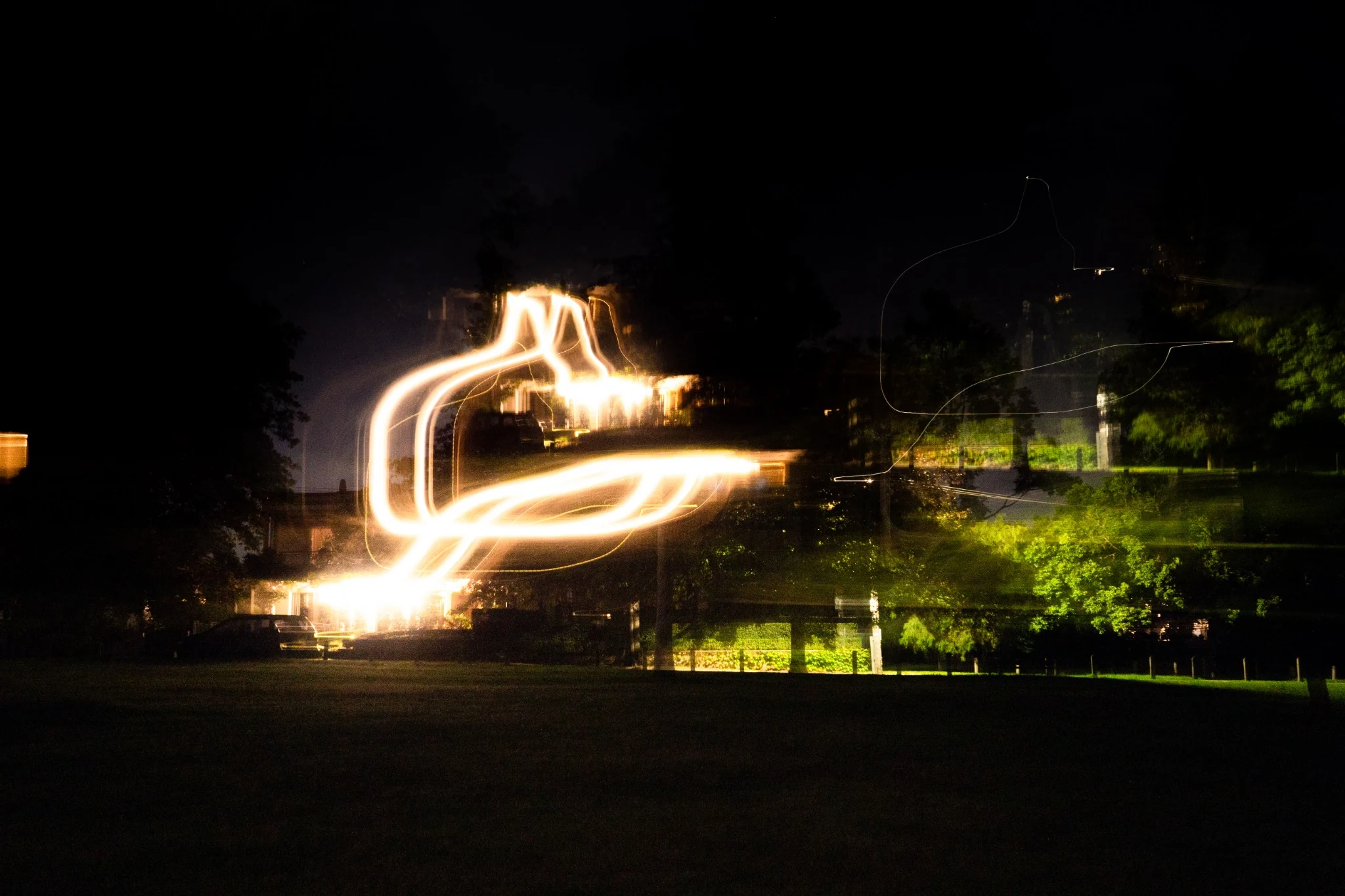 Abstract looping light shape in a dark field